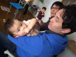 Daisuke holding his baby daughter